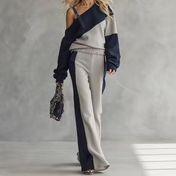 Elevate your wardrobe with our stylish color-block sweatshirt and wide-leg pants set. Perfect for any occasion, available in multiple colors and sizes!